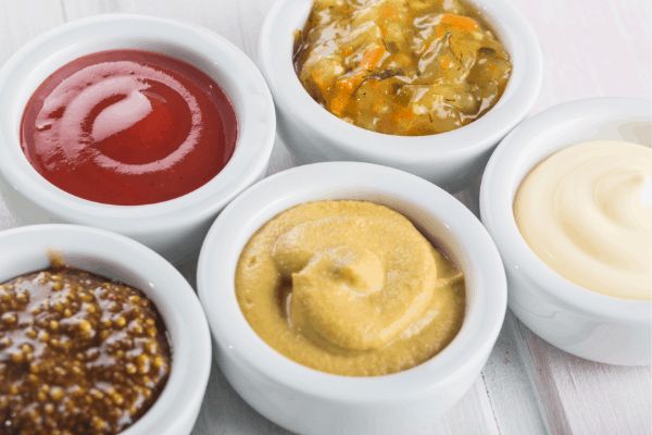 five basic dips in white round dip dishes